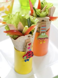 Wrap with grilled chicken and vegetables for children party, selective focus