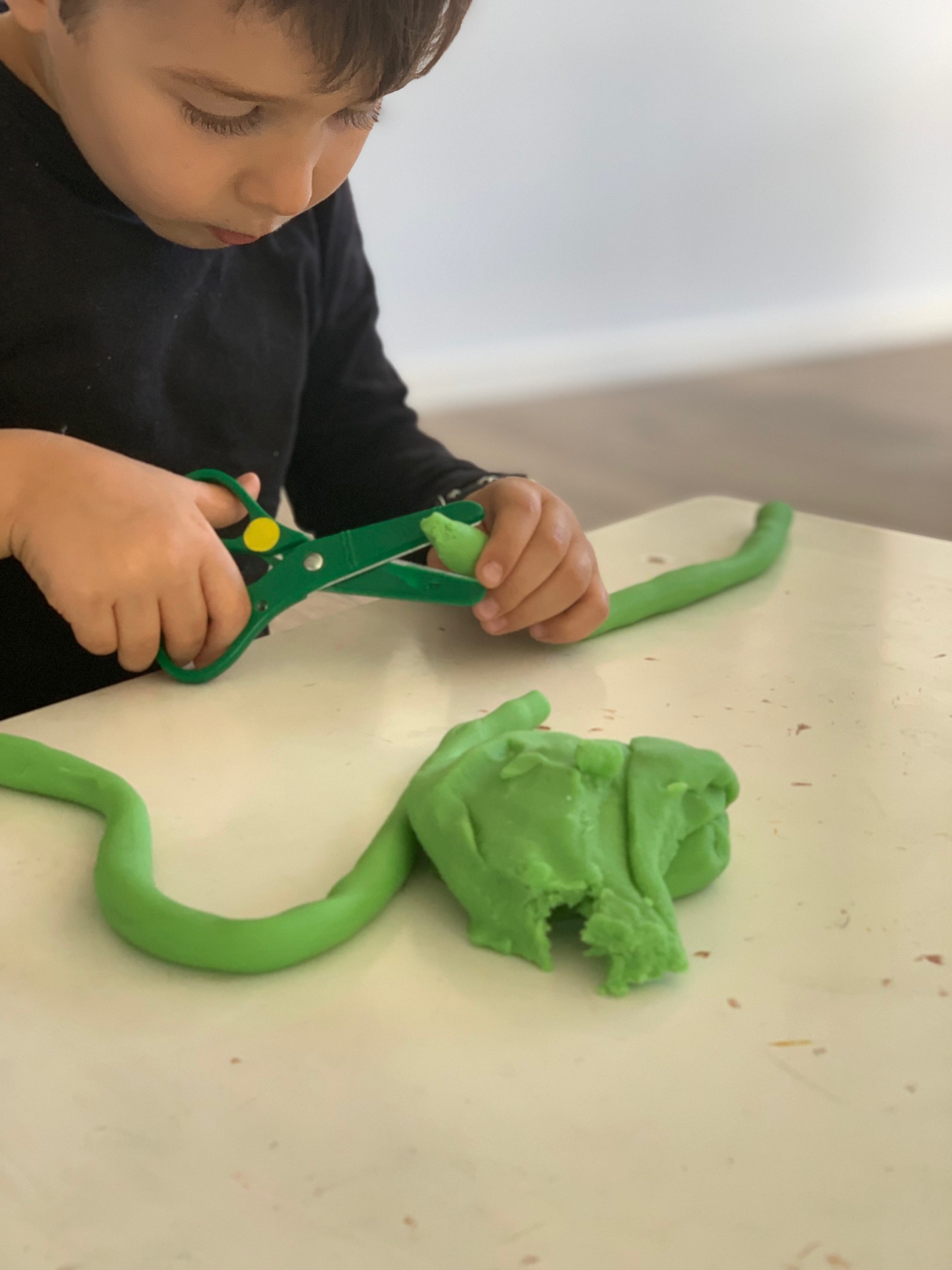 Scissor practices for preschoolers: Yarn play dough person 